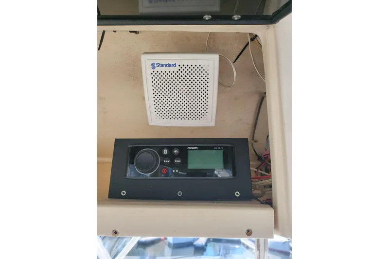 Slide: The Image of Audio system and speaker on 2004 Grady-White Marlin 300 boat dashboard. - 15