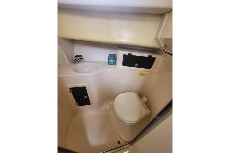 Slide: The Image of 2004 Grady-White Marlin 300 boat bathroom with sink and toilet. - 19