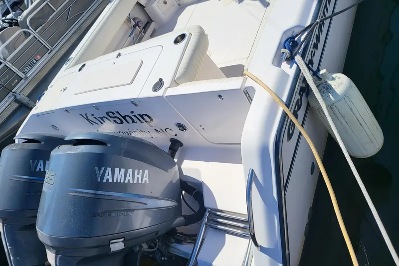 Slide: The Image of 2004 Grady-White Marlin 300 boat with Yamaha engines docked at marina. - 25