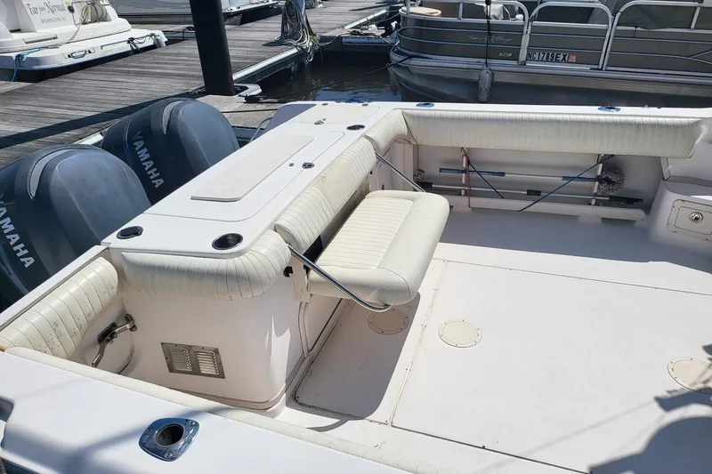 Slide: The Image of 2004 Grady-White Marlin 300 boat with Yamaha engines at dock. - 26