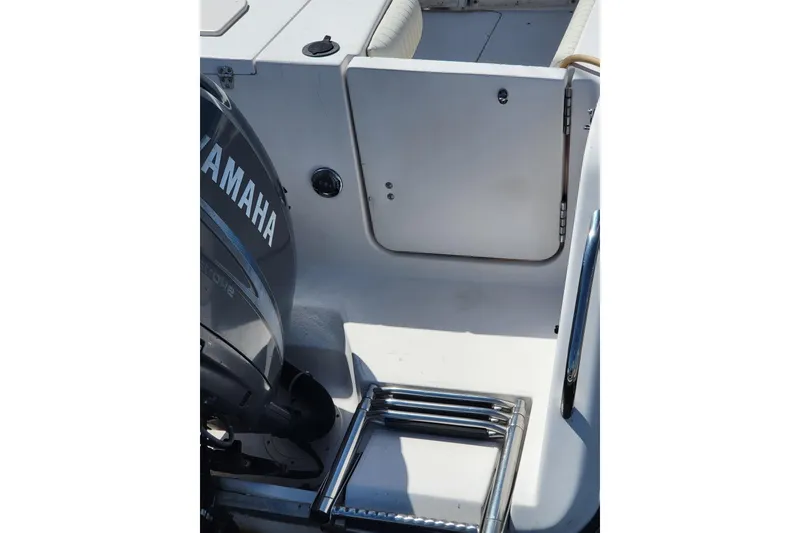 Slide: The Image of 2004 Grady-White Marlin 300 boat with Yamaha engine and swim ladder. - 4