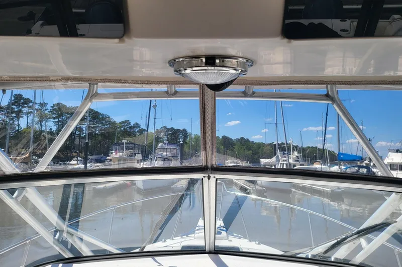 Slide: The Image of View from 2004 Grady-White Marlin 300 boat cockpit, overlooking marina with sailboats. - 7