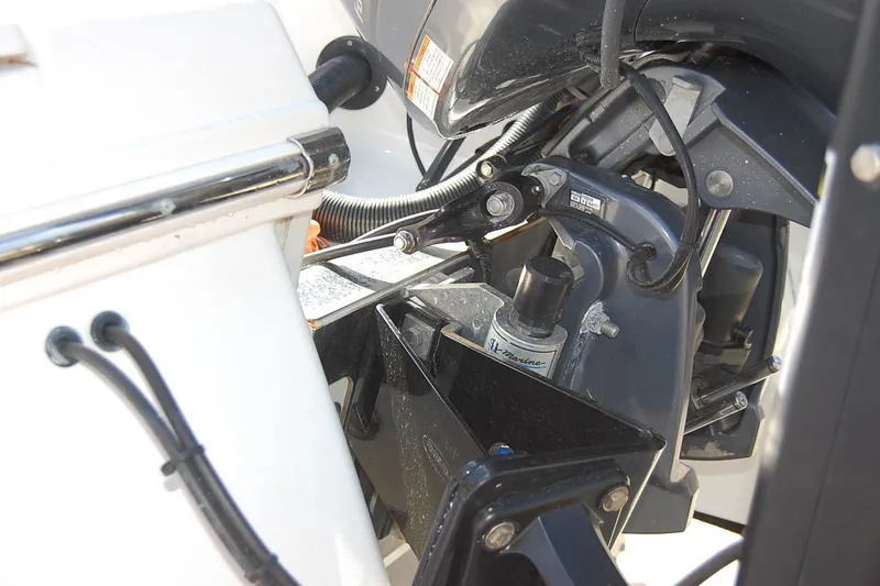 Slide: The Image of 2019 Robalo 226 Cayman boat engine close-up with hydraulic components. - 5