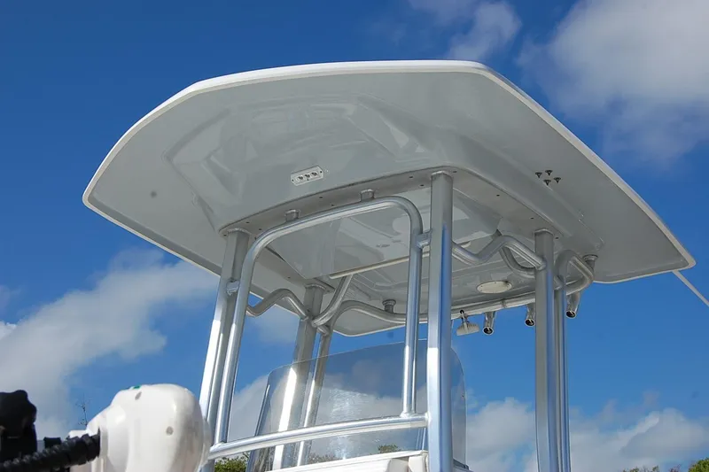 Slide: The Image of 2019 Robalo 226 Cayman T-top against a clear blue sky. - 9