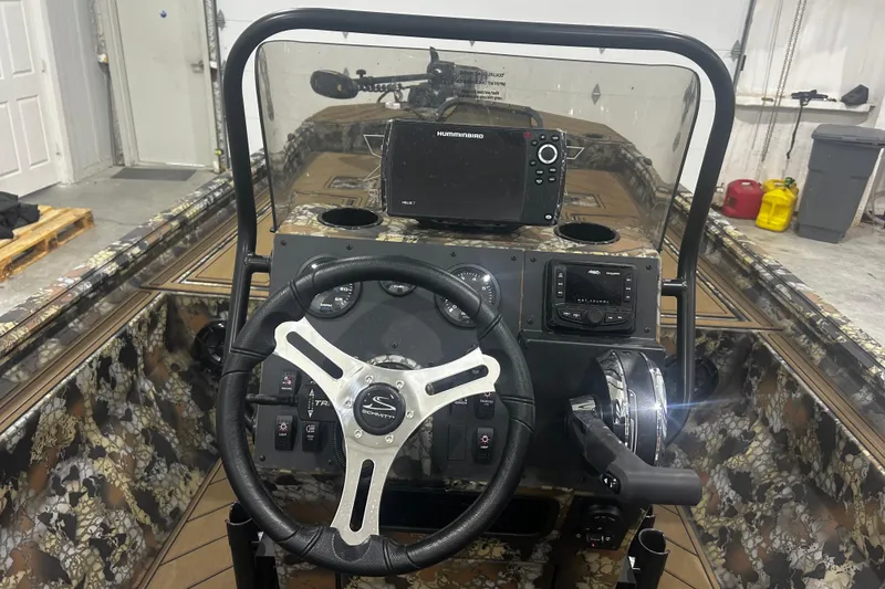 Slide: The Image of 2026 Thor Lake Hammer CC 1900 boat dashboard with steering wheel and navigation system. - 8
