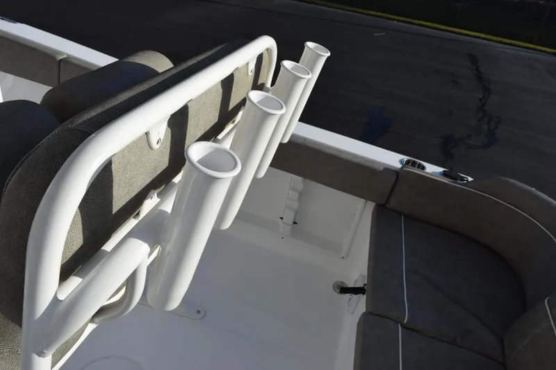 Slide: The Image of 2026 Sea Hunt Ultra 219 boat with rod holders and cushioned seating. - 10