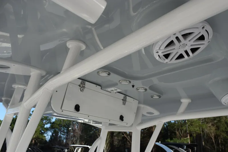 Slide: The Image of 2026 Sea Hunt Ultra 219 boat interior with speakers and storage compartment. - 11