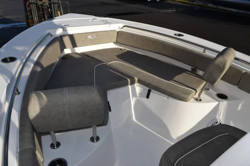 Slide: The Image of 2026 Sea Hunt Ultra 219 boat interior with cushioned seating and stainless steel railings. - 12