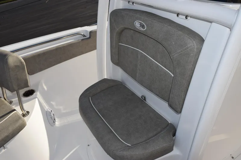 Slide: The Image of 2026 Sea Hunt Ultra 219 boat seat with gray upholstery and sleek design. - 13
