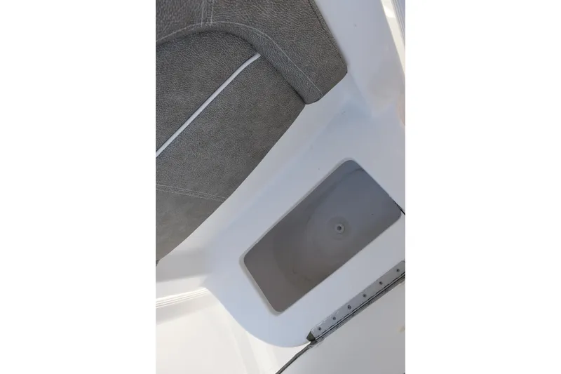 Slide: The Image of Interior view of 2026 Sea Hunt Ultra 219 boat seat and storage compartment. - 15