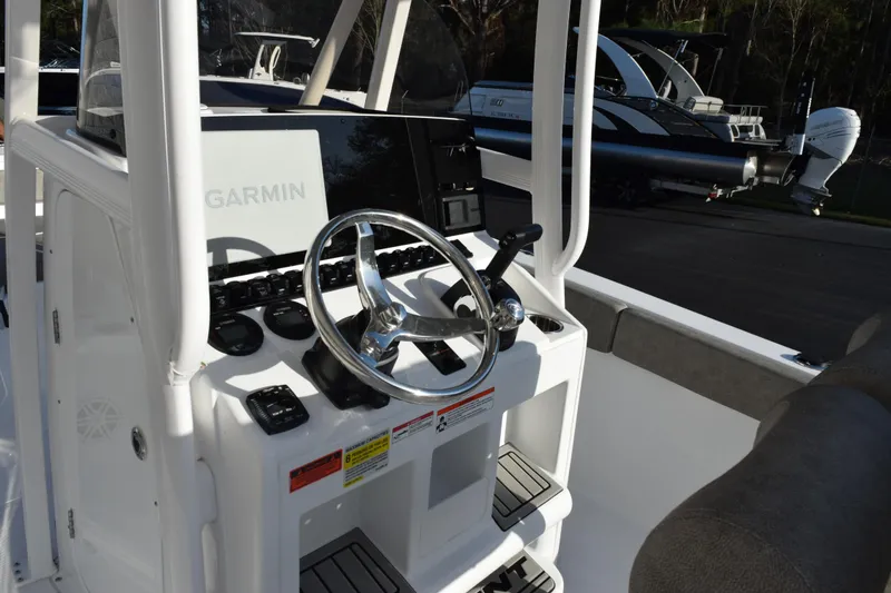 Slide: The Image of 2026 Sea Hunt Ultra 219 boat console with Garmin navigation system and steering wheel. - 7