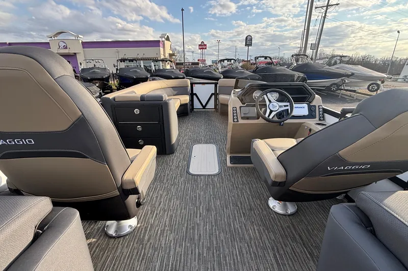 Slide: The Image of Interior of 2026 Viaggio Lago X24U boat with modern seating and steering console. - 15