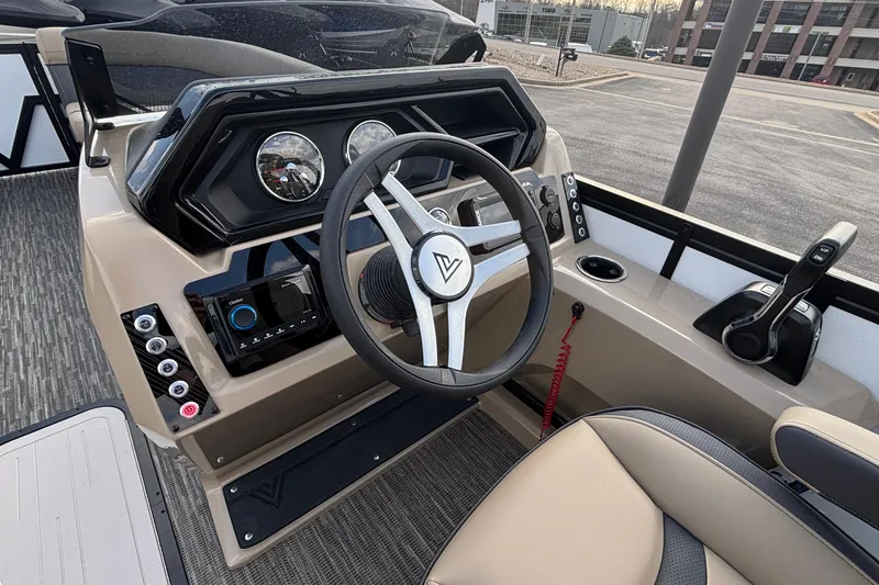 Slide: The Image of 2026 Viaggio Lago X24U boat dashboard with steering wheel and control panel. - 18