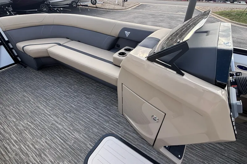 Slide: The Image of 2026 Viaggio Lago X24U boat interior with beige seating and modern dashboard design. - 24