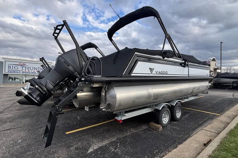 Slide: The Image of 2026 Viaggio Lago X24U pontoon boat on trailer at marina parking lot. - 36