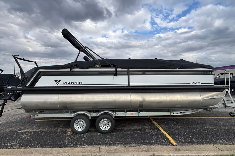 Slide: The Image of 2026 Viaggio Lago X24U pontoon boat on trailer under cloudy sky. - 37