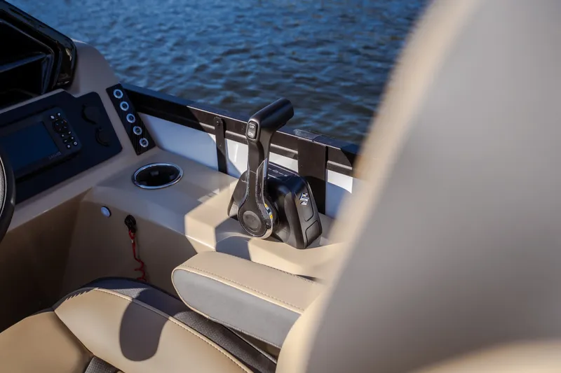 Slide: The Image of Interior of 2026 Viaggio Lago X24U boat with control panel and throttle lever. - 18
