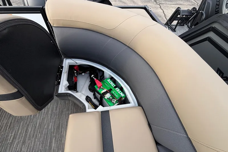 Slide: The Image of Open storage compartment in 2026 Viaggio Lago X24U boat with visible items inside. - 4