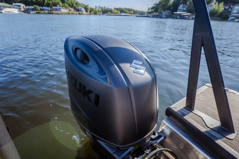 Slide: The Image of Outboard motor on Viaggio Lago X24U boat, 2026 model, on a serene lake. - 38