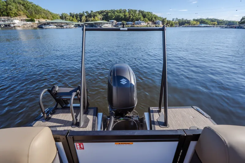 Slide: The Image of 2026 Viaggio Lago X24U pontoon boat on a serene lake with scenic background. - 36