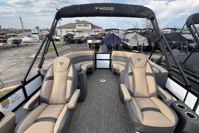 Slide: The Image of 2026 Viaggio Lago X24U boat interior with luxurious seating and canopy in a marina setting. - 7