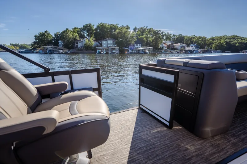 Slide: The Image of 2026 Viaggio Lago X24U pontoon boat interior with lake view and comfortable seating. - 22