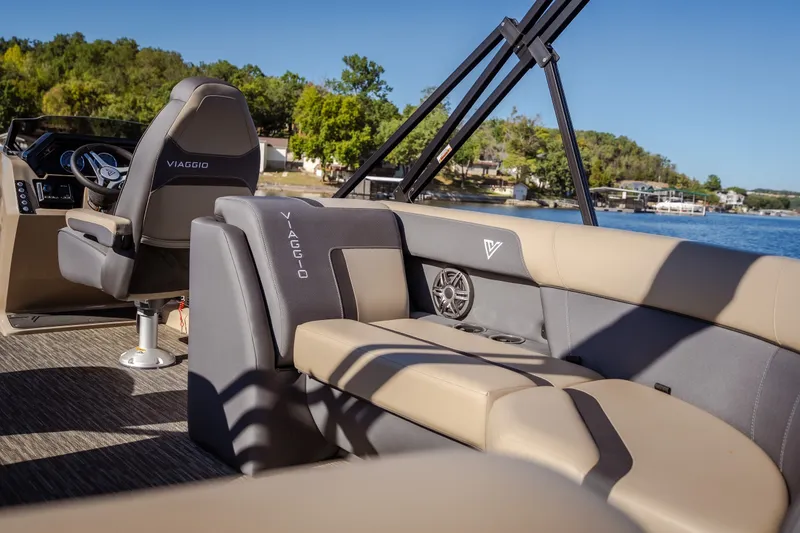 Slide: The Image of 2026 Viaggio Lago X24U boat interior with luxurious seating and scenic lake view. - 11