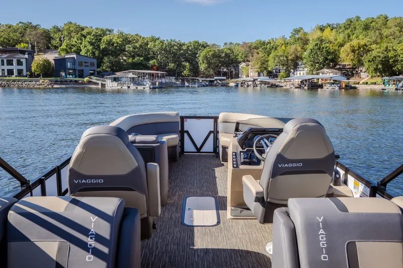 Slide: The Image of Viaggio Lago X24U 2026 pontoon boat interior on a scenic lake. - 12