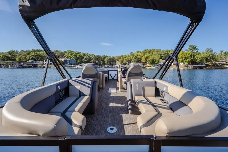 Slide: The Image of 2026 Viaggio Lago X24U pontoon boat with spacious seating on a serene lake. - 9
