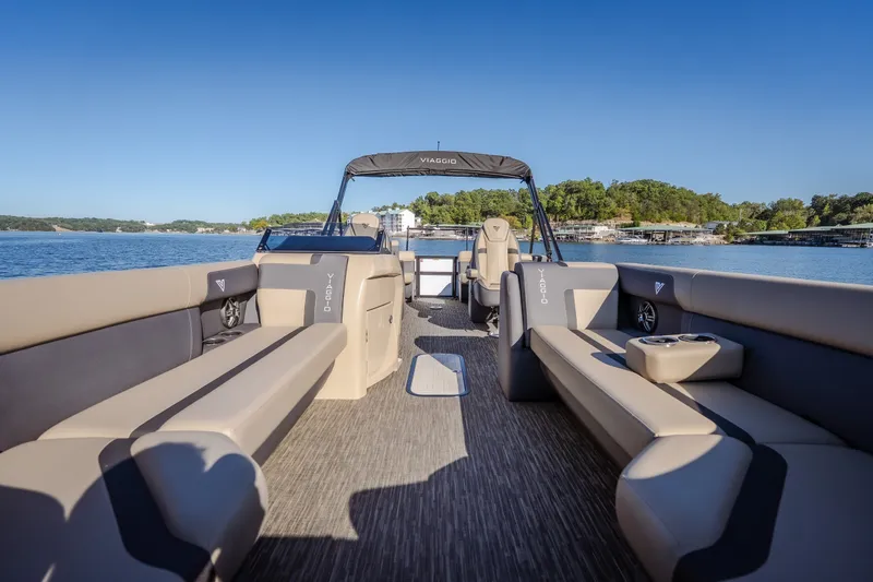 Slide: The Image of 2026 Viaggio Lago X24U pontoon boat interior on a serene lake. - 28