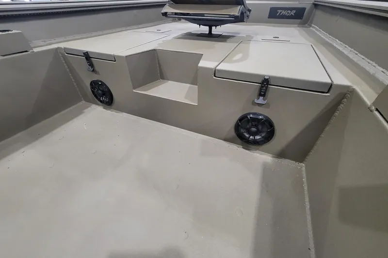 Slide: The Image of Interior of 2026 Thor 1860 Timber Hammer Elite boat with storage compartments and speakers. - 14
