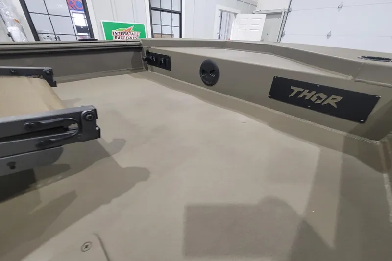 Slide: The Image of Interior of 2026 Thor 1860 Timber Hammer Elite boat, featuring sleek design and branding. - 15