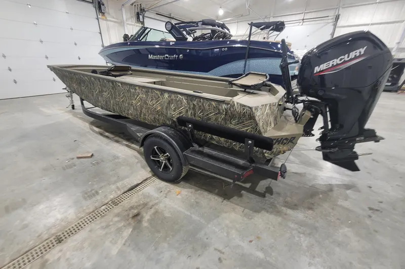 Slide: The Image of 2026 Thor 1860 Timber Hammer Elite boat with camouflage design and Mercury outboard motor. - 5