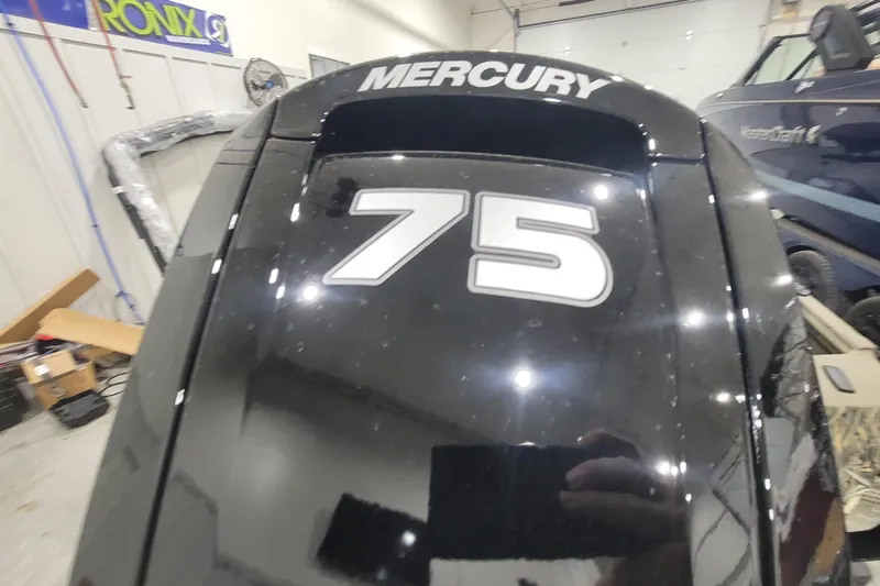 Slide: The Image of Mercury 75 outboard motor in a workshop, near Thor 1860 Timber Hammer Elite. - 8