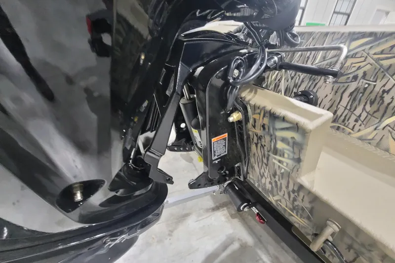 Slide: The Image of 2026 Thor 1860 Timber Hammer Elite boat engine and camouflage interior detail. - 9