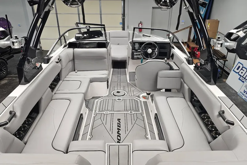 Slide: The Image of 2024 Moomba Mojo boat interior with sleek seating and modern dashboard design. - 14