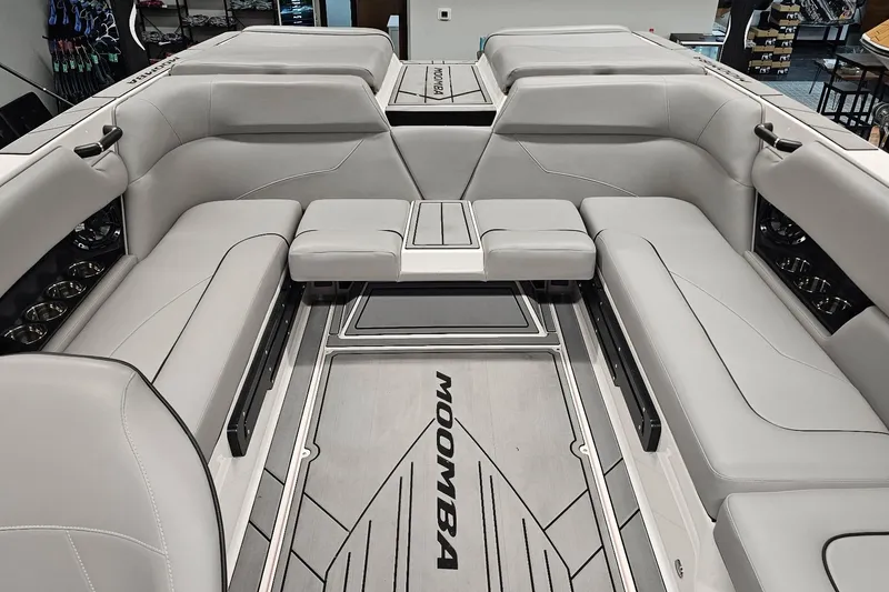 Slide: The Image of 2024 Moomba Mojo boat interior with sleek gray seating and modern design. - 15