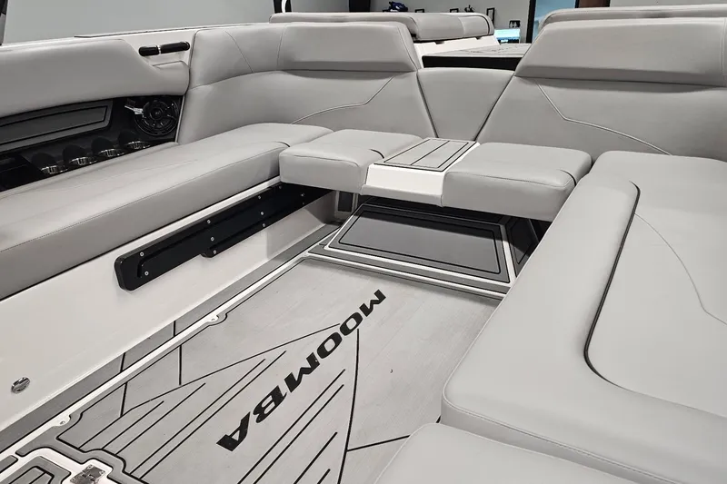 Slide: The Image of 2024 Moomba Mojo boat interior with sleek gray seating and modern design. - 17