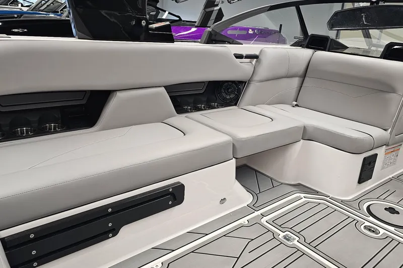 Slide: The Image of 2024 Moomba Mojo boat interior with sleek gray seating and modern design. - 18