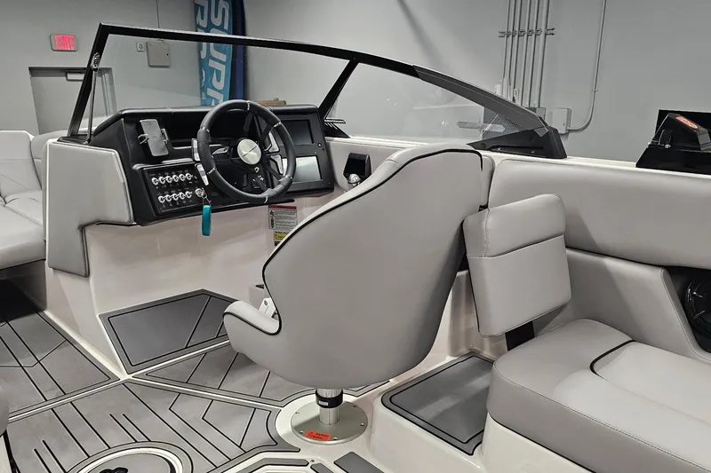 Slide: The Image of 2024 Moomba Mojo boat interior with modern dashboard and steering wheel. - 19