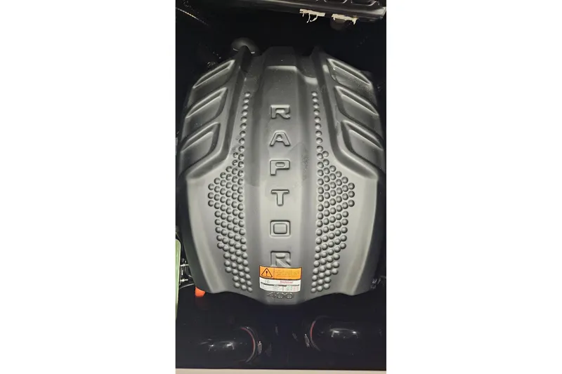 Slide: The Image of 2024 Moomba Mojo engine cover with "Raptor" branding, showcasing robust design. - 21