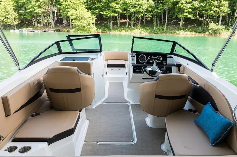 Slide: The Image of Manufacturer Provided Image: 2019 Sea Ray SPX 210 boat interior with tan seating and lake view. - 15