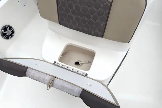 Slide: The Image of 2019 Tidewater 2410 Bay Max boat seat with storage compartment open. - 10