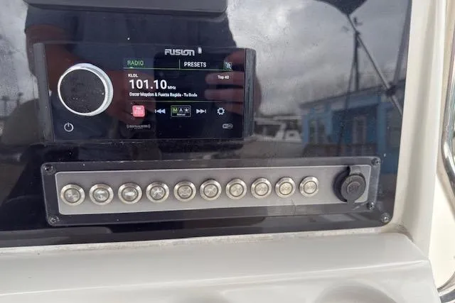 Slide: The Image of Control panel of 2019 Tidewater 2410 Bay Max boat with radio display. - 15