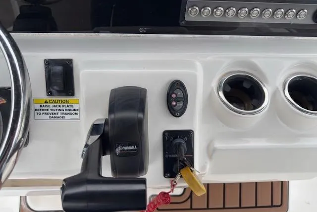Slide: The Image of Control panel of 2019 Tidewater 2410 Bay Max boat with Yamaha throttle and cup holders. - 16