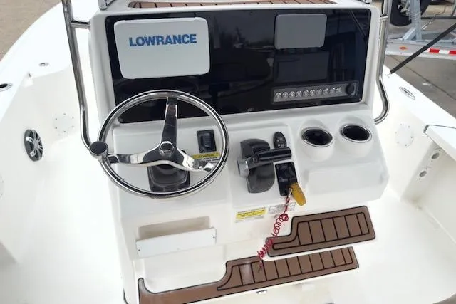 Slide: The Image of 2019 Tidewater 2410 Bay Max boat console with steering wheel and Lowrance electronics. - 8