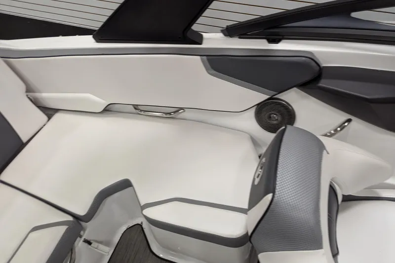 Slide: The Image of 2023 Scarab 195 ID boat interior with sleek white and gray seating design. - 13