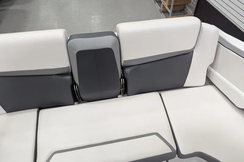 Slide: The Image of 2023 Scarab 195 ID boat interior seating, featuring sleek white and gray upholstery design. - 15