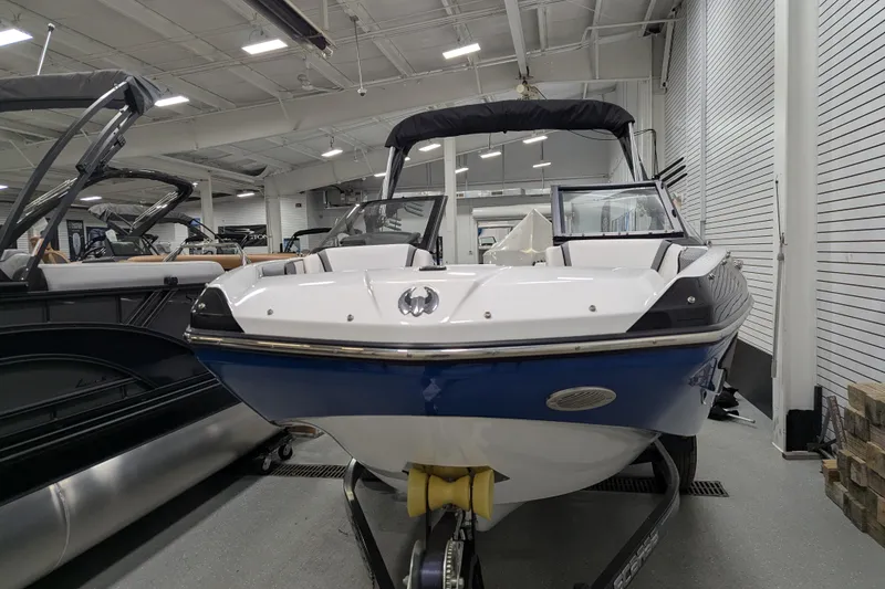 Slide: The Image of 2023 Scarab 195 ID boat displayed indoors, featuring sleek design and modern features. - 3