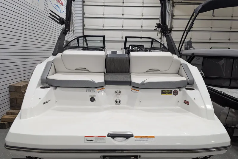 Slide: The Image of 2023 Scarab 195 ID boat interior with white seating and modern design. - 5